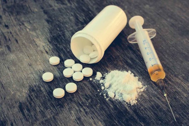 pills powder and syringe, heroin rehab