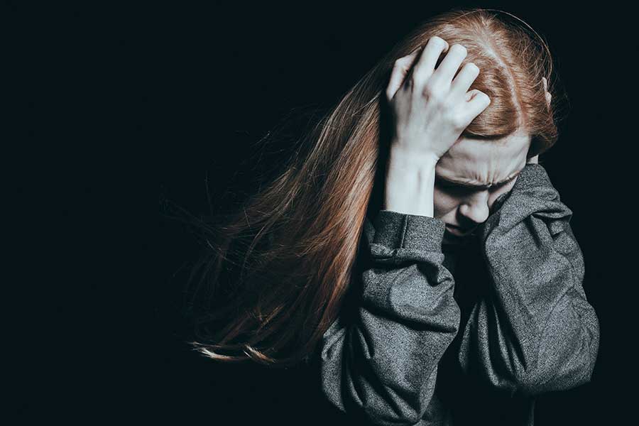 A young woman struggle with addiction relapse