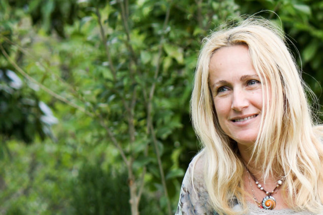 woman smiling outside after austin drug and alcohol abuse program