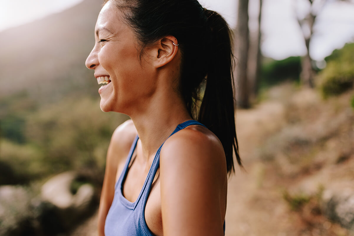 woman laughing on a hike during substance abuse treatment near houston