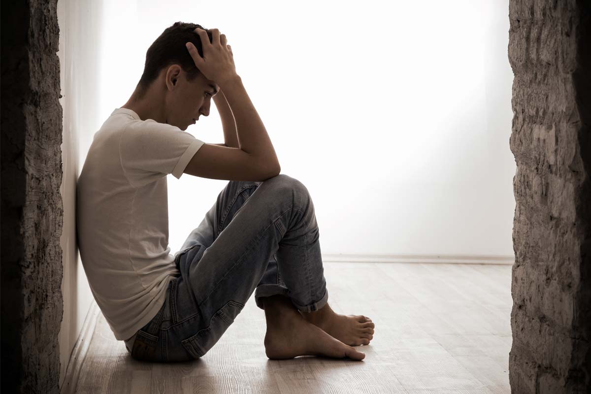 man sitting on floor needing more than Austin Cocaine Drug Rehab