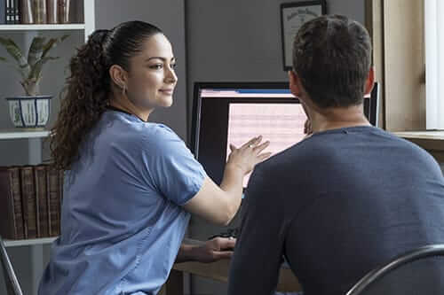 nurse helping a client at an Austin wellness education