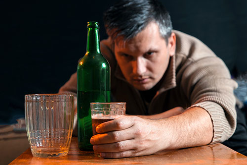 man struggling with alcohol use disorder