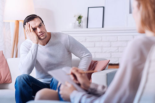 man participating in individual counseling for addiction