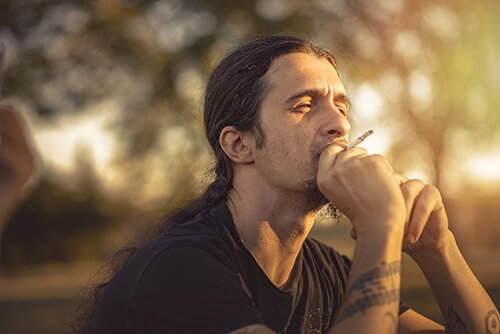 young man smoking and wondering is marijuana addictive
