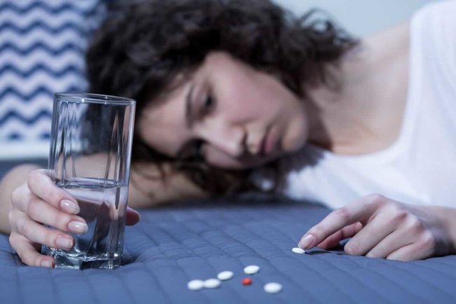 woman suffering from a sleeping pill addiction