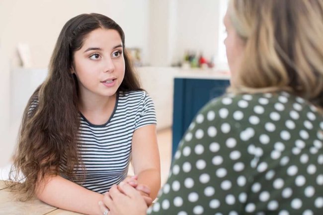 young girl talking with her mom about World Bipolar Day