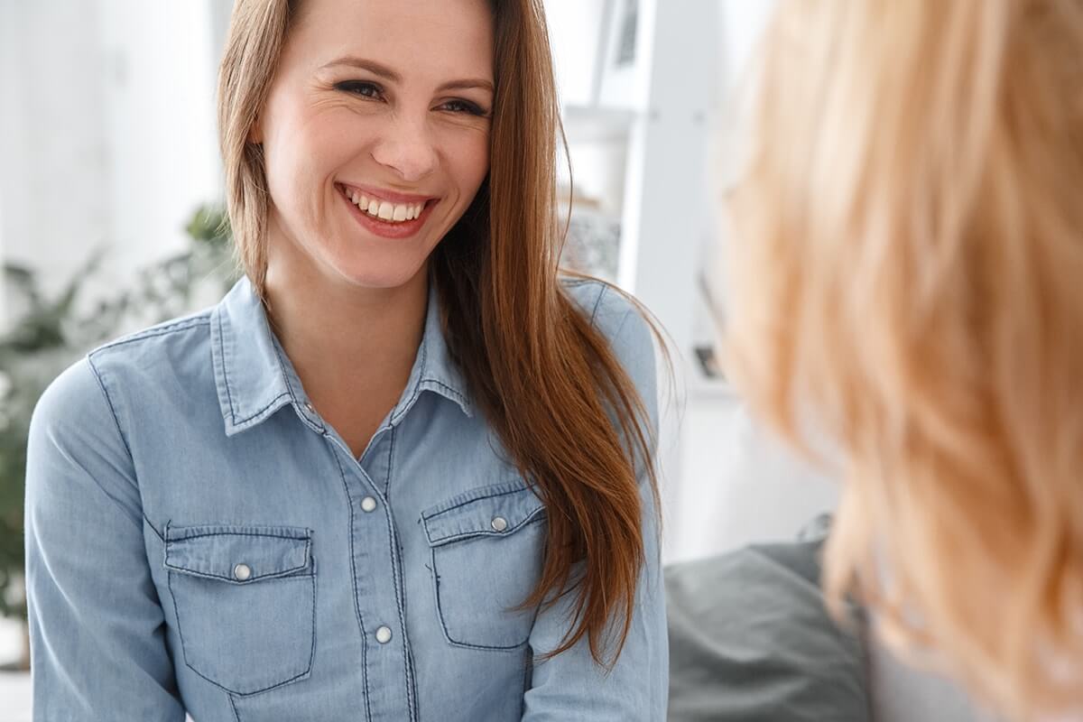 two friends discussing rehab for women