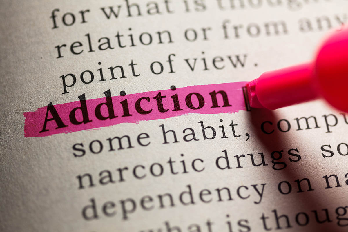 addiction definition being highlighted in hot pink