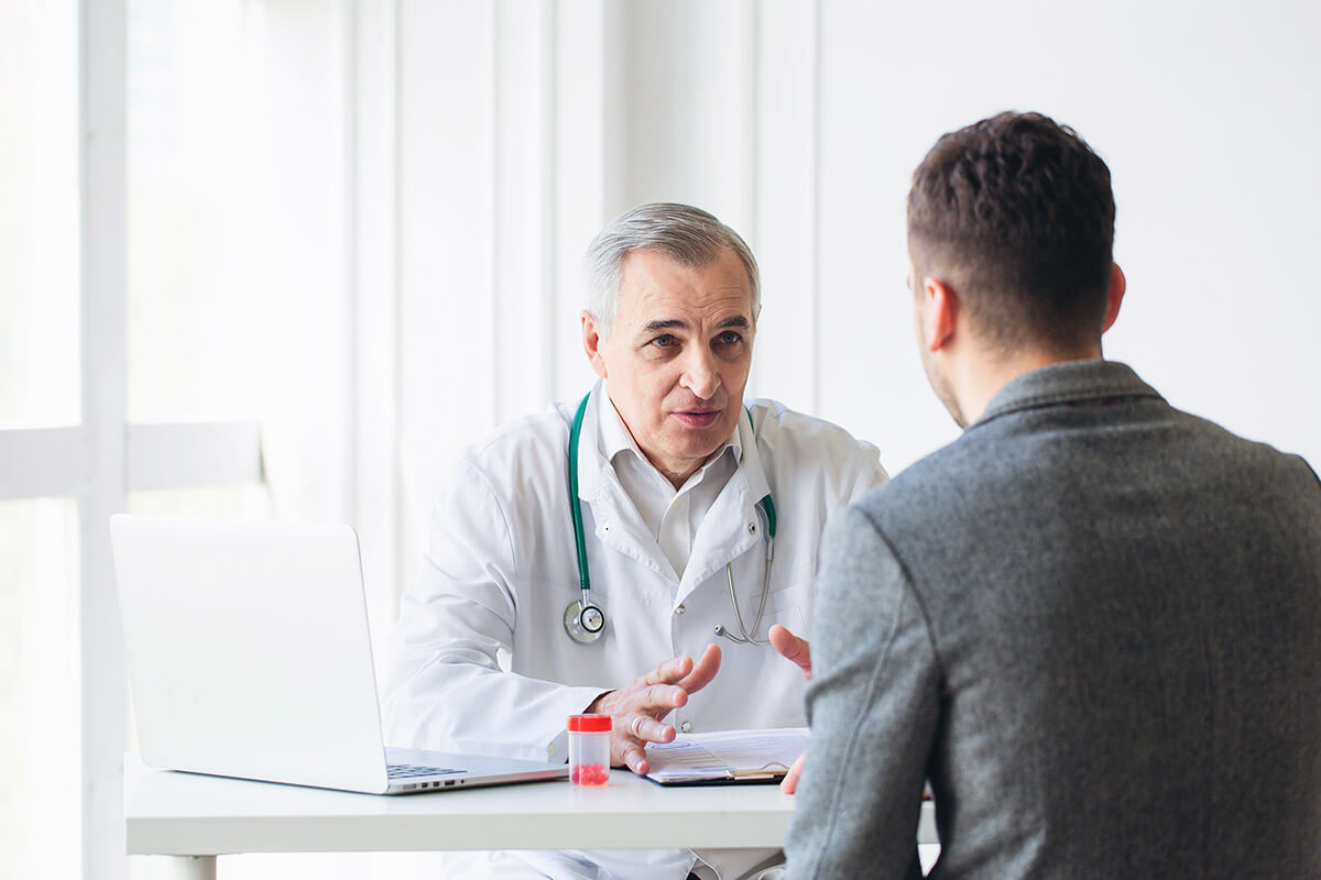 man and doctor discuss how to get off opiates