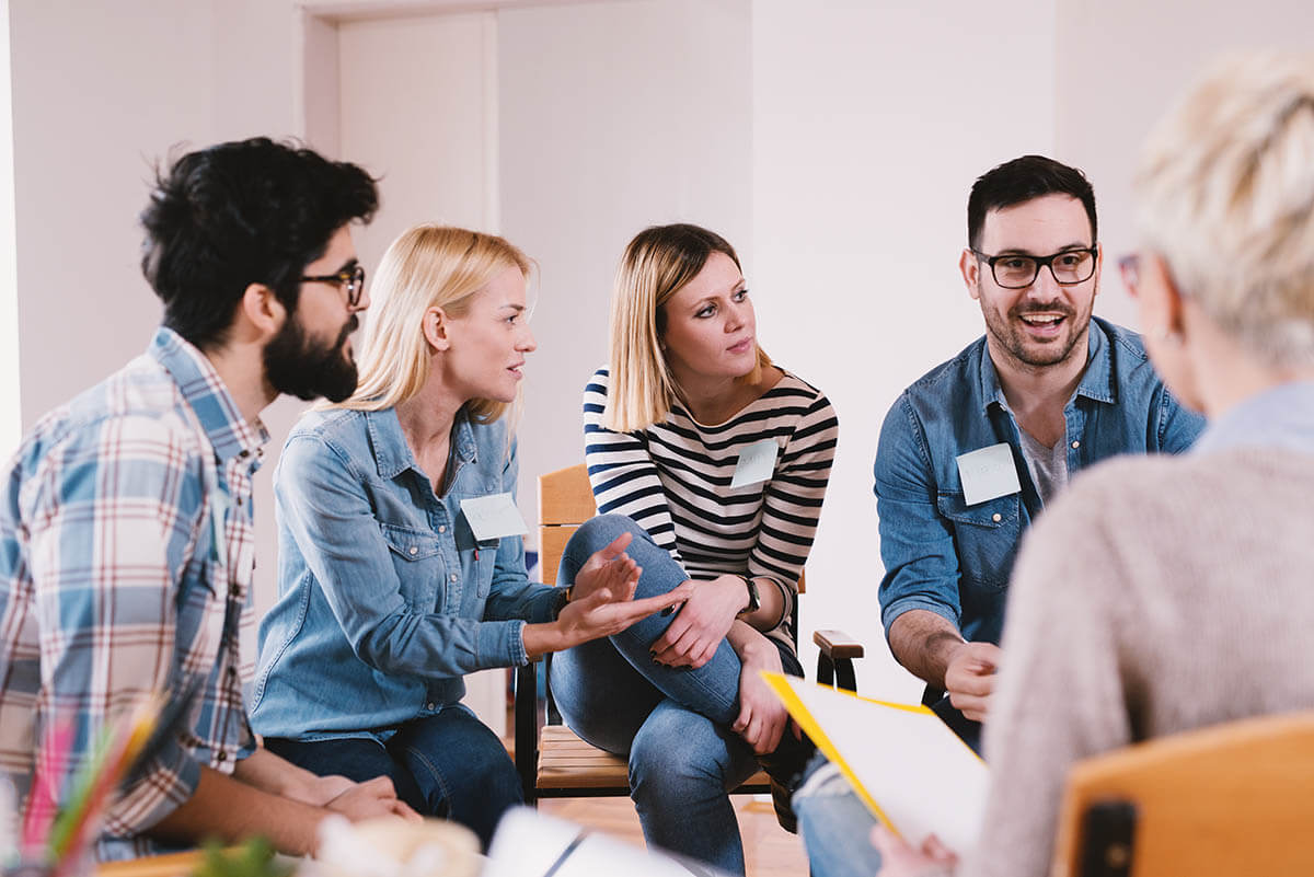 therapy circle discussing inpatient vs outpatient