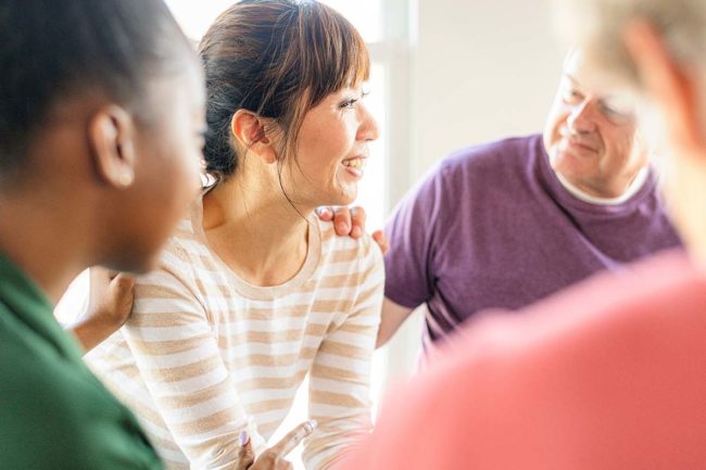 people in a group therapy program