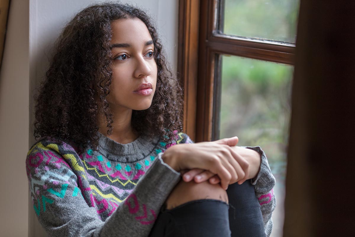 A teenager thinking about their teen drug abuse