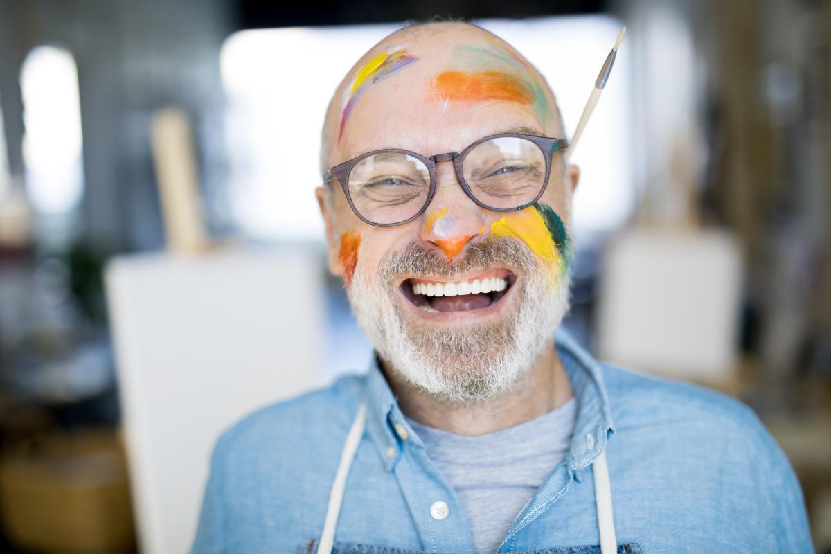 man with paint on his face doing an alternative to AA