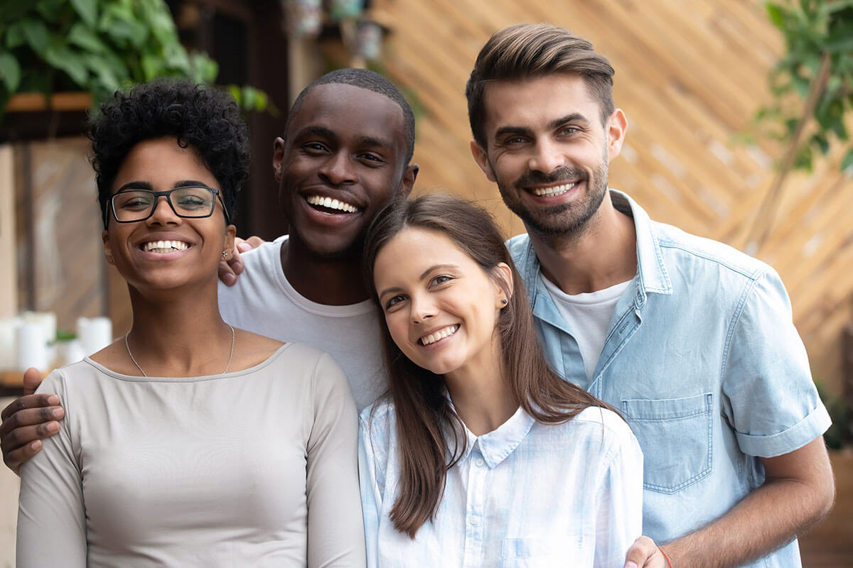 2 men and 2 women smiling because they have core values to guide recovery