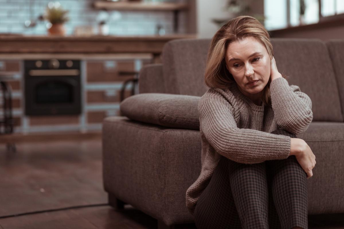 Woman wondering, "Is alcohol a depressant?"