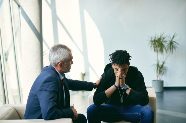 Two men discuss, "What is a 12-step program?"