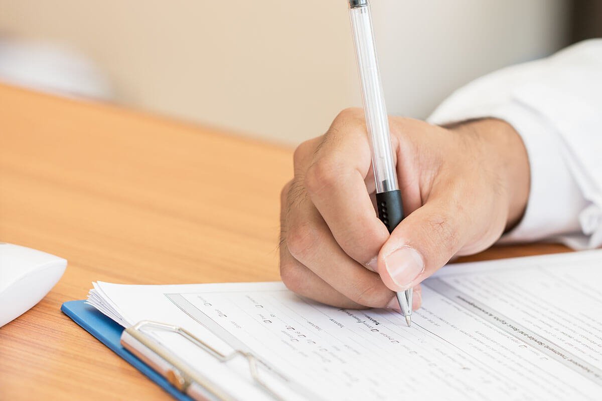 man filling out substance abuse evaluation Houston