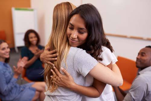 two women hugging at Heroin Rehab Near Austin TX