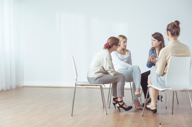 individuals at a recovery center talking