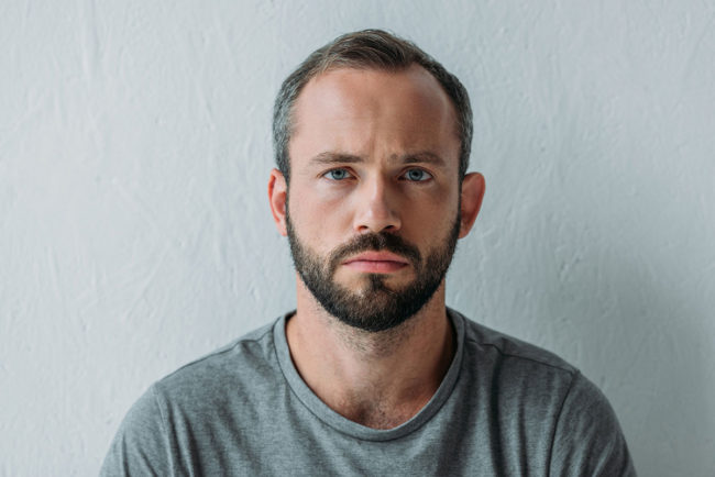 Man feeling the long-term effects of prescription drug abuse