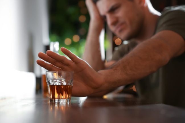 man struggles with alcohol