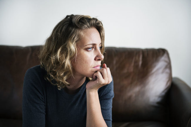 person on couch wondering how long is meth withdrawal