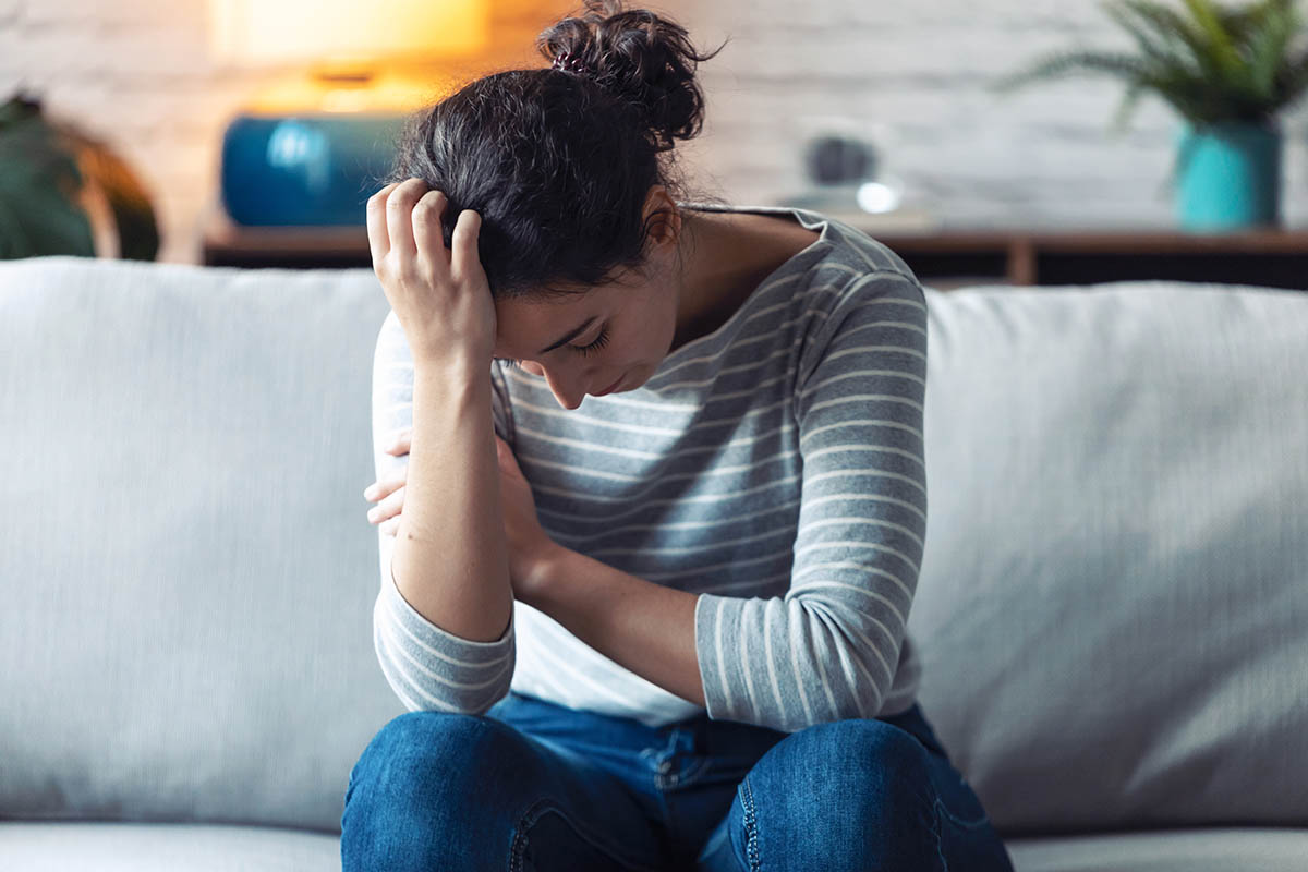 A woman feeling the effects of alcohol on the body
