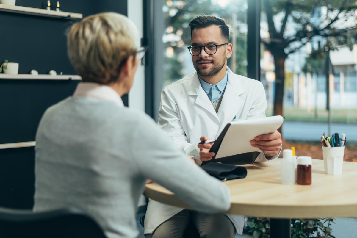 doctor discussing medication assisted treatment benefits with patient