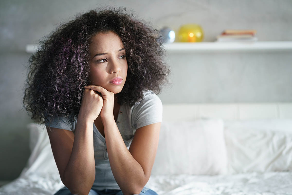 Woman thinking about understanding alcoholism