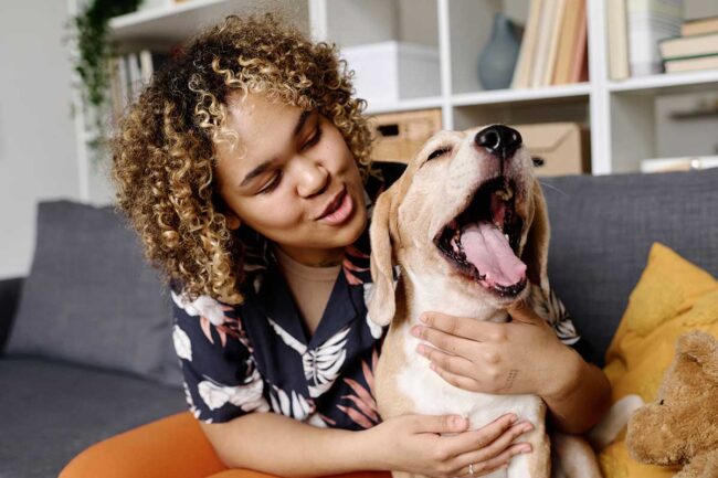 Woman enjoying the benefits of animal assisted therapy