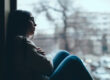 Woman thinking about the causes of addiction relapse