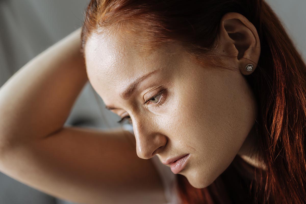 Young woman very concerned about symptoms of morphine addiction