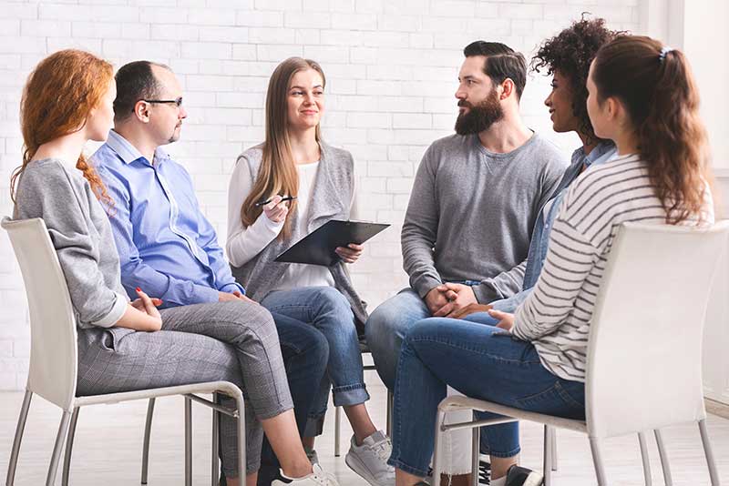 A group of people in addiction recovery