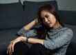 A young woman thinking about the benefits of addiction therapy