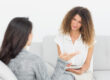 Two women talking about insurance coverage for heroin rehab