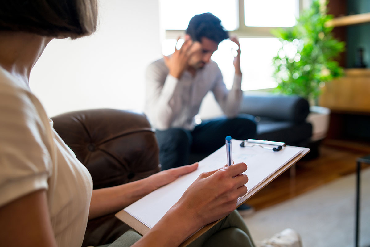 Man and therapist in the rehab facilities at San Antonio Recovery Center