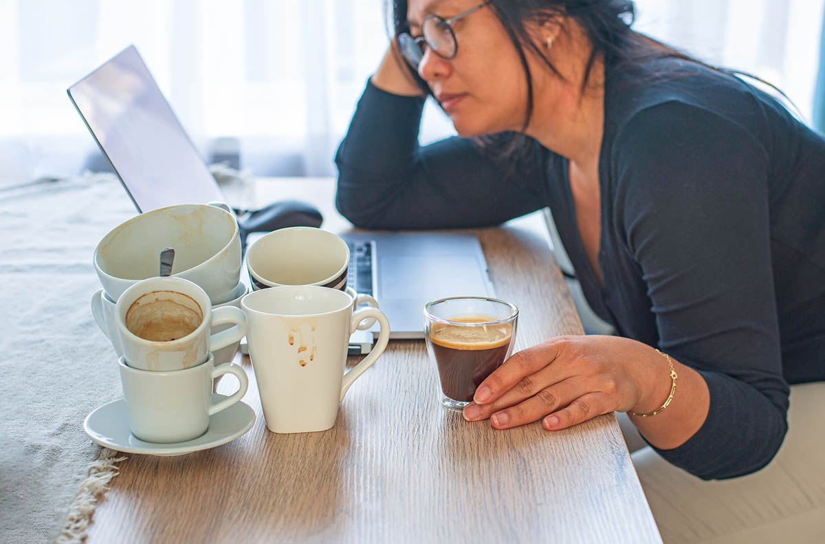 A woman wondering, "Does caffeine addiction lead to drug addiction?"