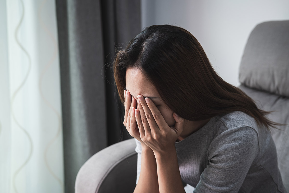 Woman thinking about long-term effects of prescription drug abuse