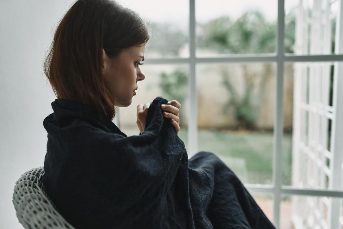 Woman thinking about the biggest factors of addiction