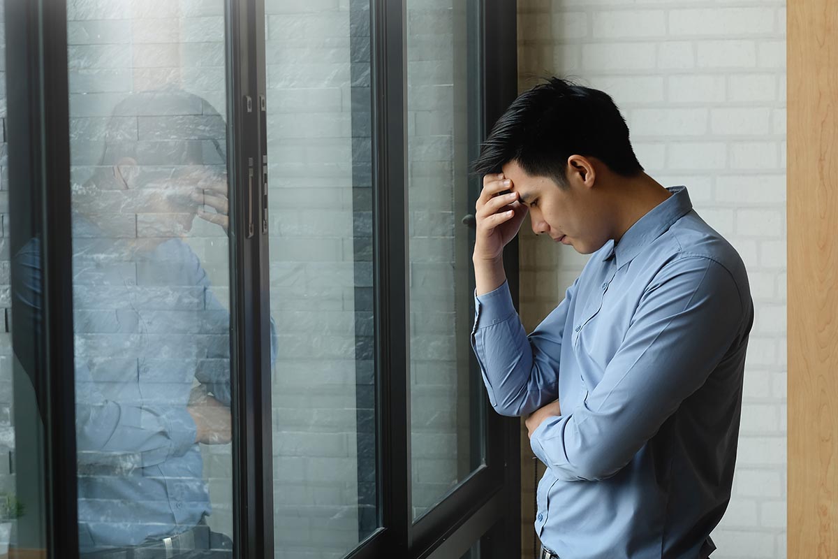 Man getting upset thinking about the heroin overdose timeline