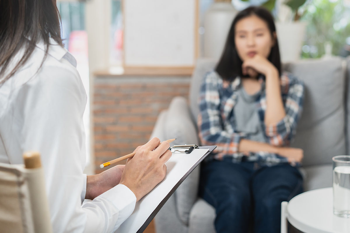 Woman asking a therapist, "What drugs are benzos?"